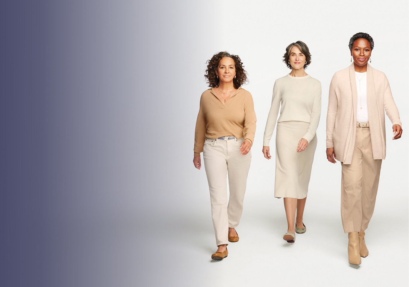 Three women walking toward camera.